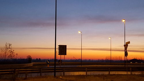 Road sign against sky