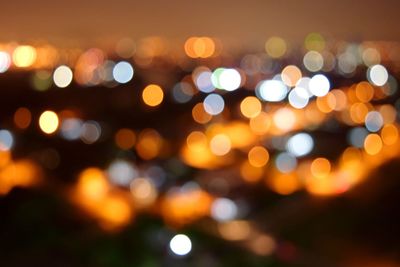 Defocused image of illuminated lights at night