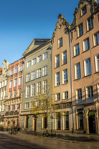 Low angle view of buildings against blue sky