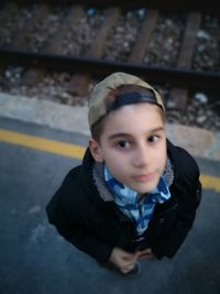 High angle portrait of boy standing outdoors