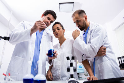 Scientist showing research to colleagues in laboratory