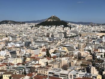 High angle shot of townscape against clear sky