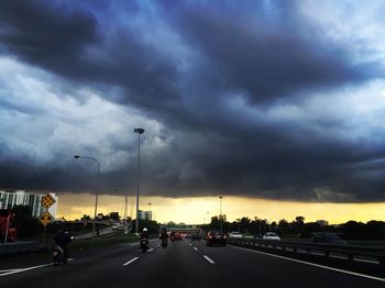 Road passing through dramatic sky