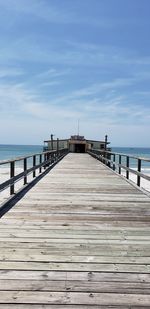 Pier over sea against sky