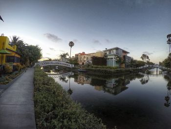 Reflection of houses and trees in water
