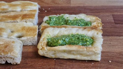 Close-up of typical food of genova - foccacia with green pesto genovese