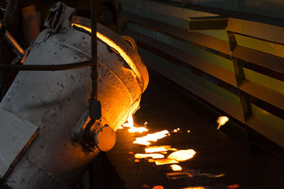 Molten metal poured from lathe for iron casting at industry