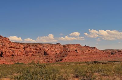 Rock formations on landscape against sky