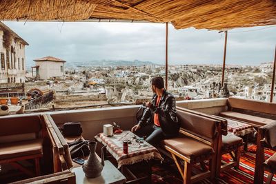 Man sitting on table in restaurant