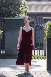 Portrait of young woman walking outside