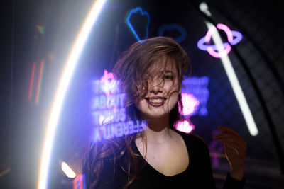 Portrait of woman looking at music concert