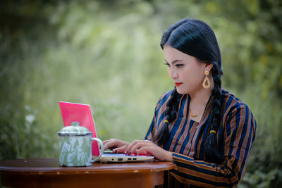 Young woman using mobile phone