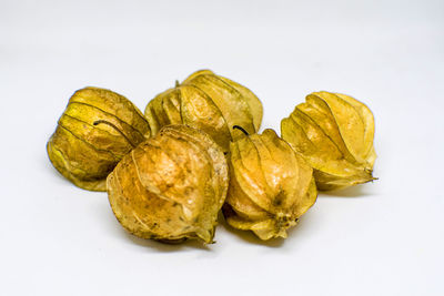 Close-up of lemon slice against white background