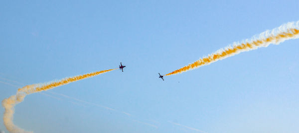 Low angle view of airplane flying in sky