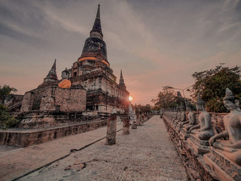 Panoramic view of temple building against sky during sunset