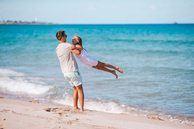 Man standing on beach against sea