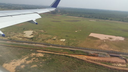 Cropped image of airplane on landscape