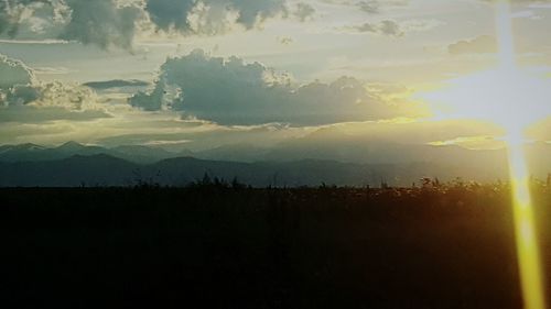 Scenic view of silhouette landscape against sky at sunset