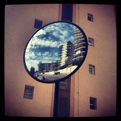 Reflection of buildings on glass window