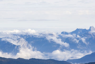 Clouds against mountain range