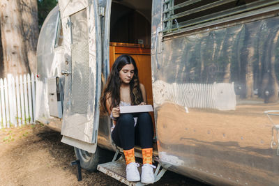 Portrait of woman sitting on seat