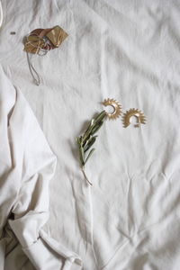 High angle view of butterfly on bed