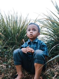 Portrait of boy on field