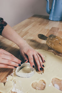 Midsection of person preparing food on table