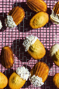 High angle view of madeleines against pink background