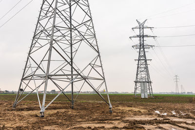 Electricity distribution system. high voltage overhead power line, power pylon, steel lattice tower