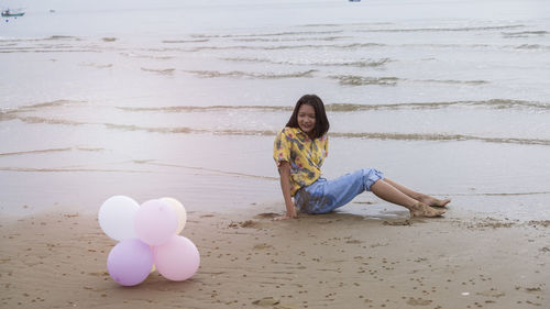 Woman sitting on beach