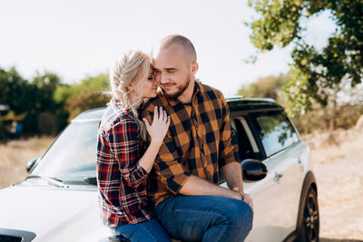 Young couple kissing in car