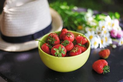 Close-up of strawberries in bowl on table