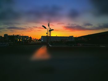 Silhouette of city during sunset