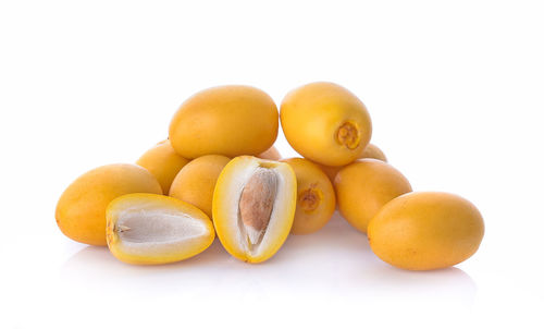 Close-up of oranges against white background