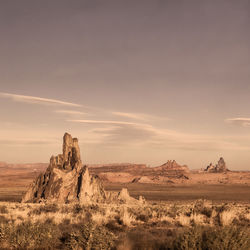 Rock formations in desert against sky