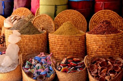 Various spices in wicker containers for sale at market
