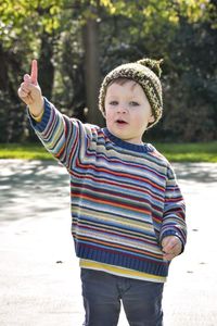 Portrait of cute boy standing in water