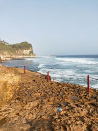 Scenic view of beach against clear sky