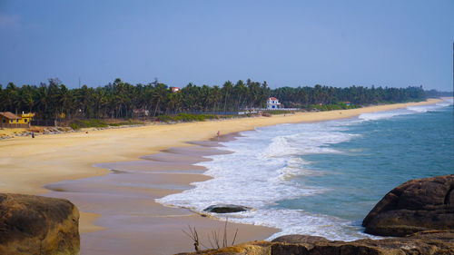 Scenic view of beach against clear sky