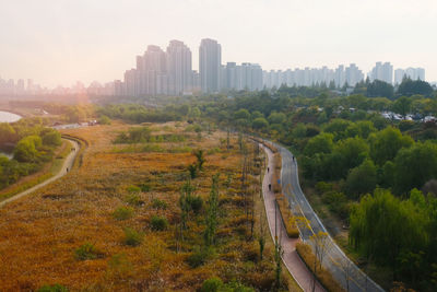 High angle view of city buildings against sky