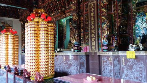 Illuminated candles in temple