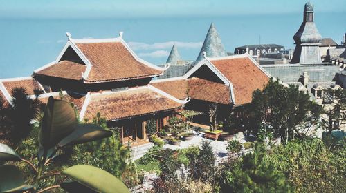 Panoramic view of houses and buildings against sky