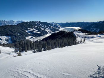 Snow covered mountains against clear sky