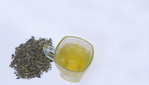 Close-up of tea cup against white background