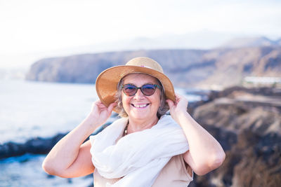 Portrait of a smiling young woman outdoors
