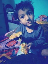 Portrait of boy holding food