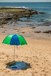 Umbrella at sandy beach