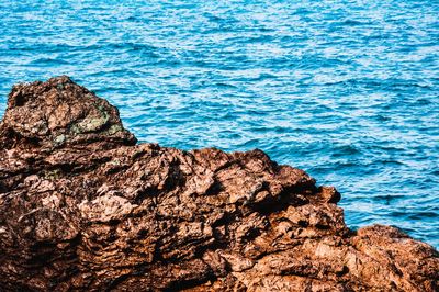 High angle view of rock formation in sea