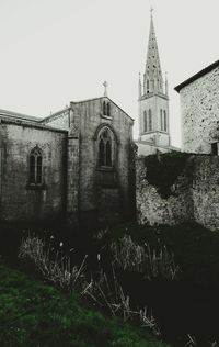 Low angle view of bell tower against sky